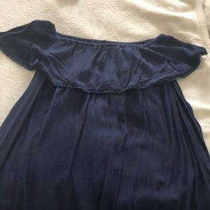 Darling navy off the shoulder dress with dot trim!